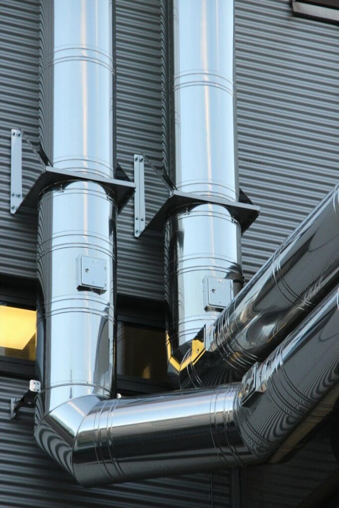 Industrial HVAC tubing installed by commercial HVAC companies on building